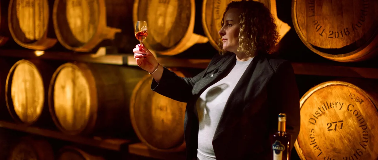 sarah burgess the lakes distillery whiskymaker holding glass | DangTau Whisky
